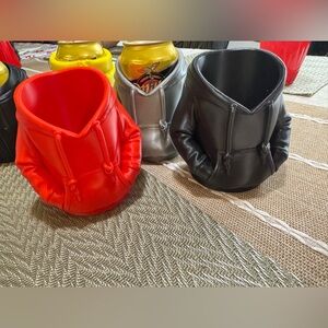 Hoodie-Shaped Drink Holders in Red, Black, and Silver